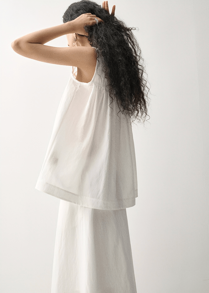 GEOMETRIC CUTOUT SLEEVELESS TUNIC - Vera Lumina